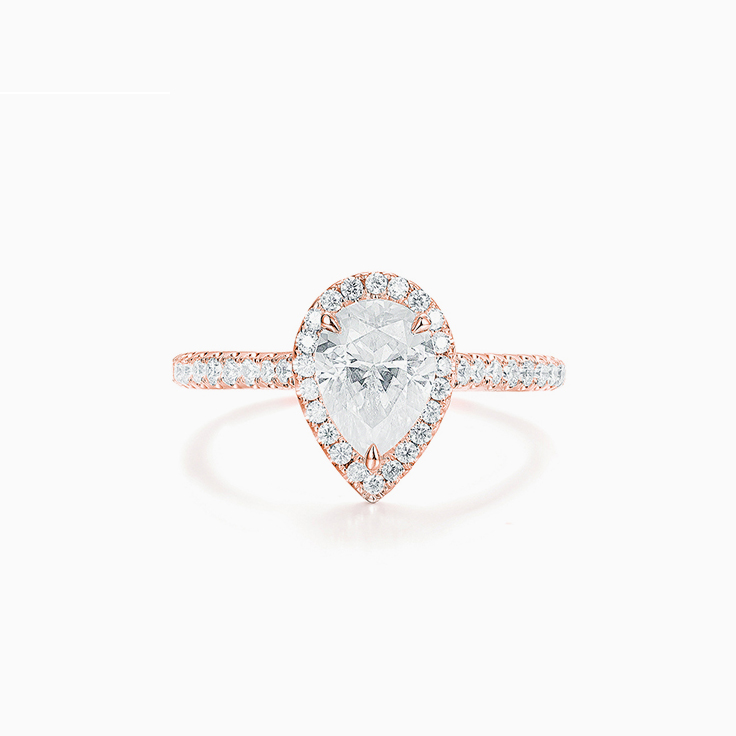 Pear Cut Diamond Engagement ring with a Diamond Halo