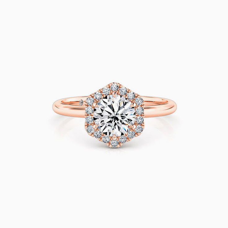 Round Brilliant cut diamond with a hexagon shape halo