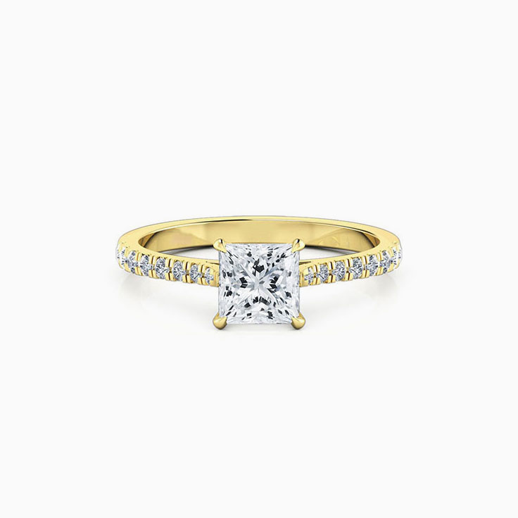 Princess cut diamond in four claw set engagement ring