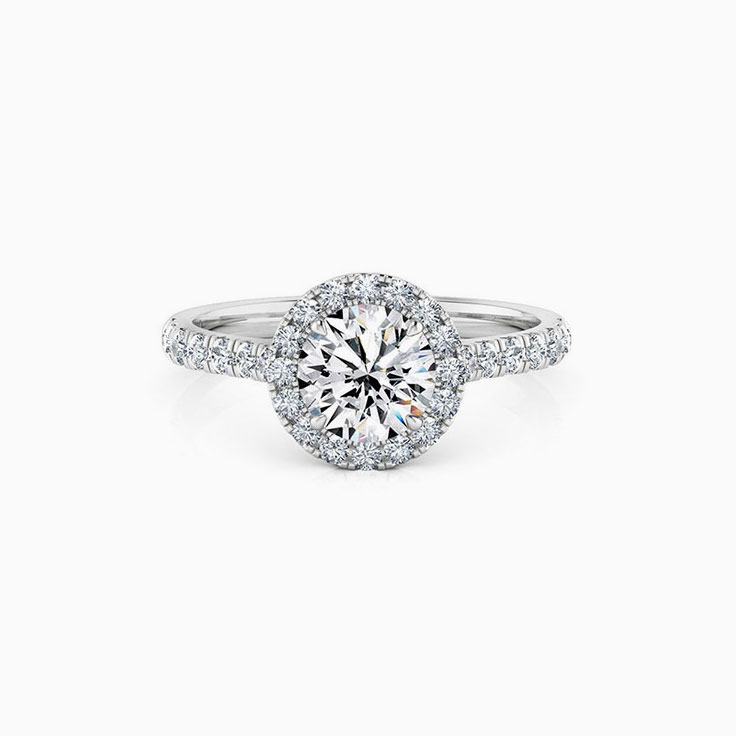 Round halo on cathedral setting engagement ring