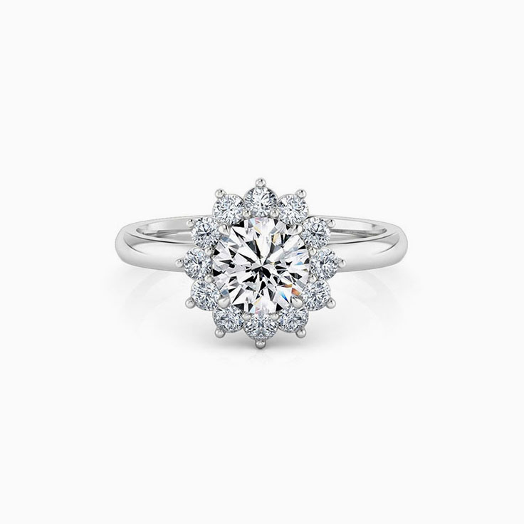 Round brilliant cut engagement ring with floral halo setting