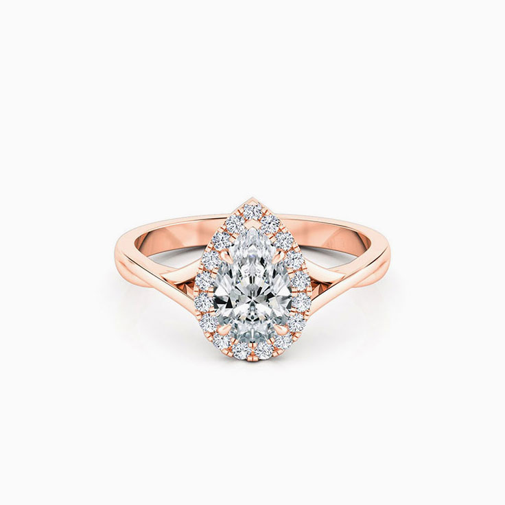 Pear cut engagement ring on a twisted plain band