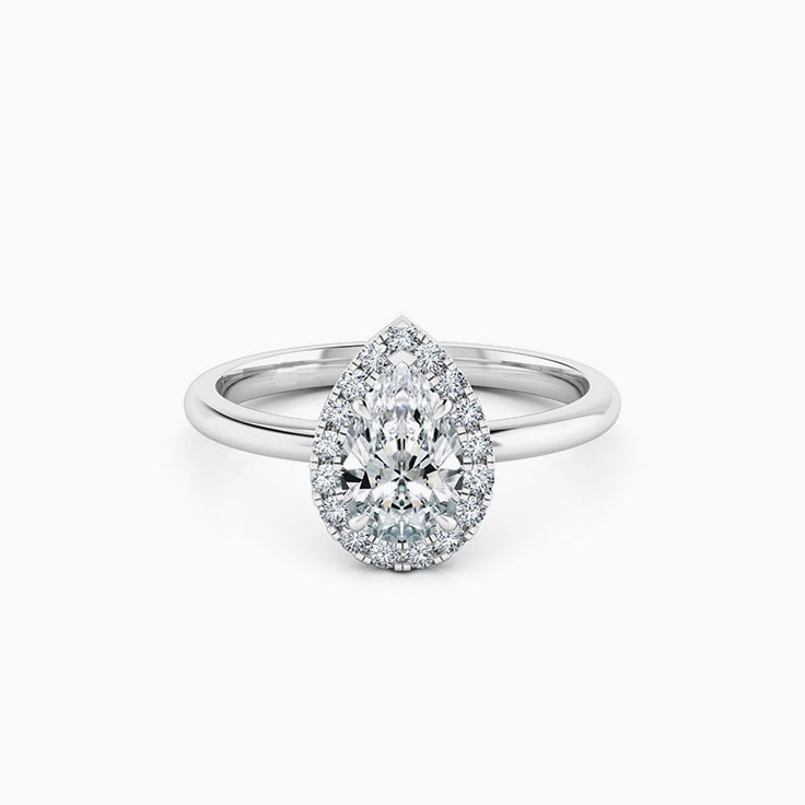 Pear diamond engagement ring with a diamond halo
