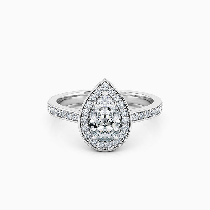 Pear cut diamond engagement ring with pave halo