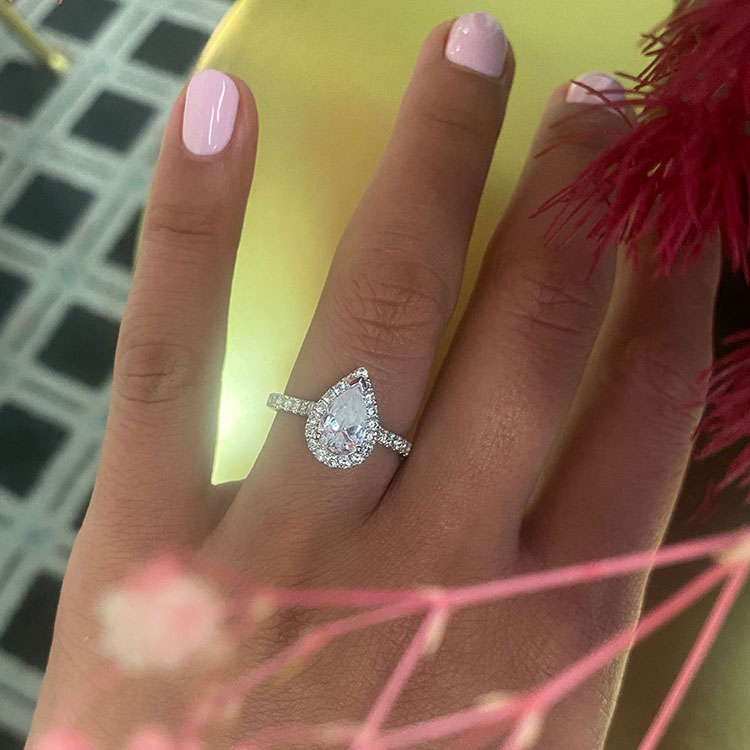 Pear Cut Diamond Engagement ring with a Diamond Halo