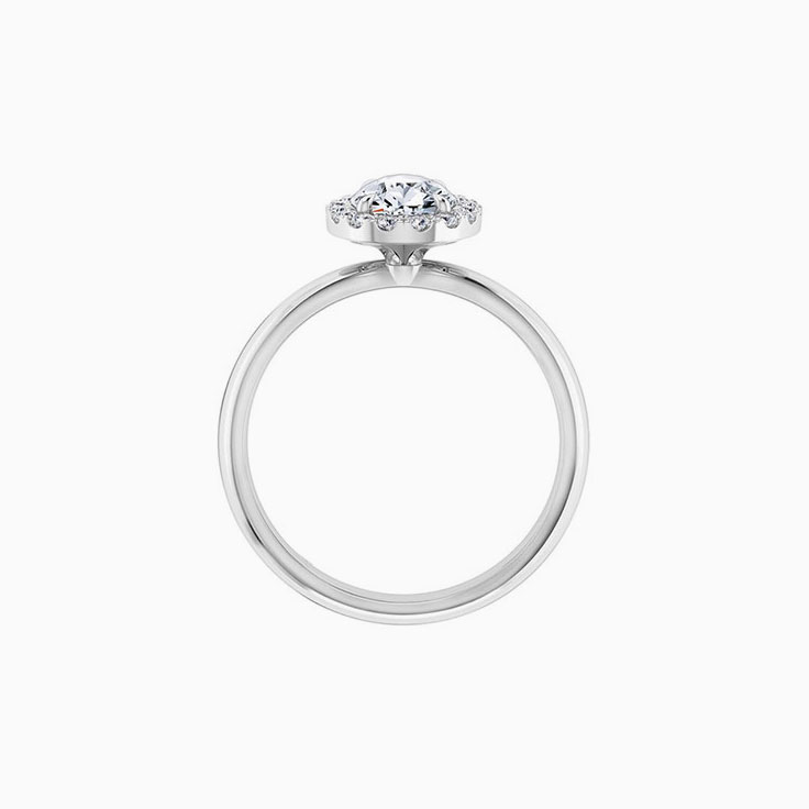 Pear diamond engagement ring with a diamond halo